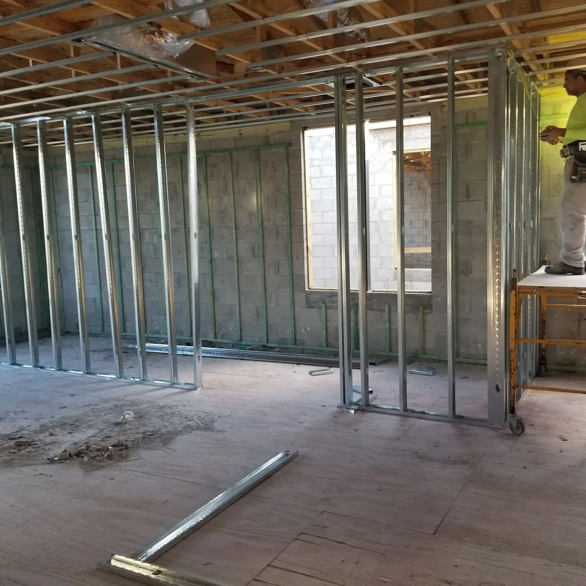 New metal-stud partitions installed inside a stripped building during reconstruction